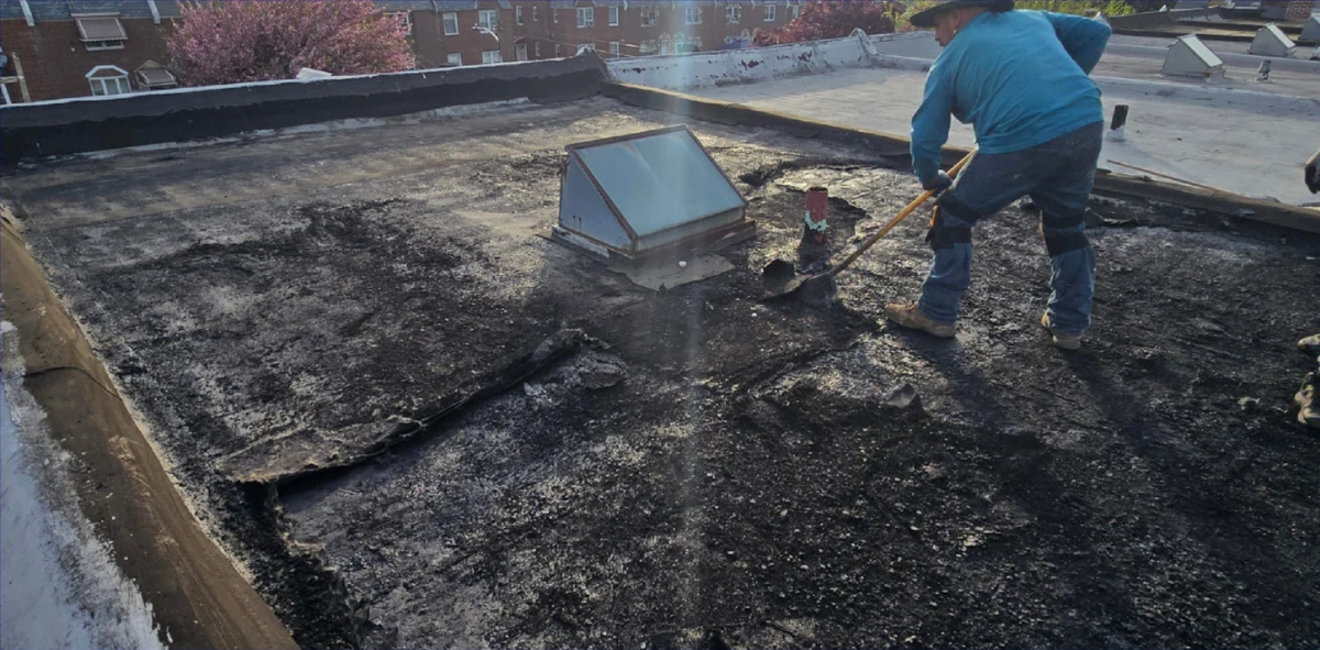 Commercial flat roof leak repair by Martin Roofing & Construction